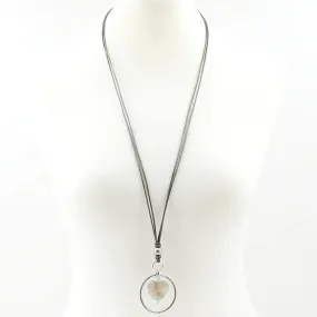 Agate stone within circle pendant on long leather necklace